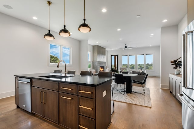2118 Cliff Dr, Nashville, TN 37218 - kitchen with dark countertops, recessed lighting, a large fireplace, dark wood-type flooring, and a ceiling fan