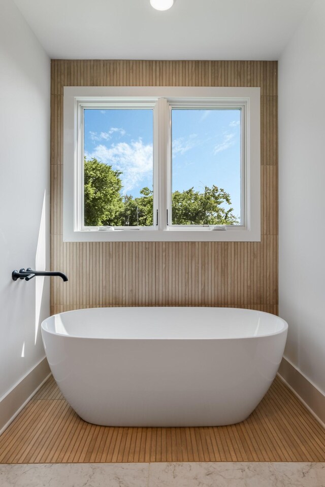2118 Cliff Dr, Nashville, TN 37218 - bathroom with a freestanding bath and marble look tiles