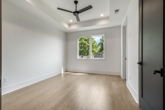 2118 Cliff Dr, Nashville, TN 37218 - unfurnished bedroom with light wood-type flooring, recessed lighting, a tray ceiling, and a ceiling fan