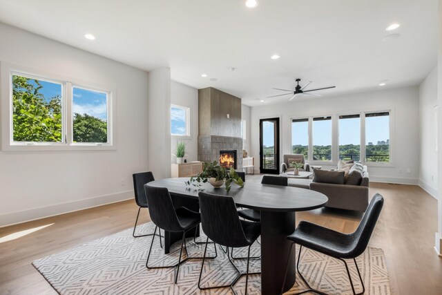 2118 Cliff Dr, Nashville, TN 37218 - dining space featuring a tile fireplace, healthy amount of natural light, recessed lighting, light wood-type flooring, and a ceiling fan