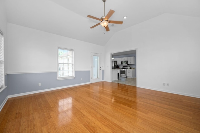 2606 Battleground Dr, Murfreesboro, TN 37129 - unfurnished living room featuring a ceiling fan, high vaulted ceiling, and light wood finished floors