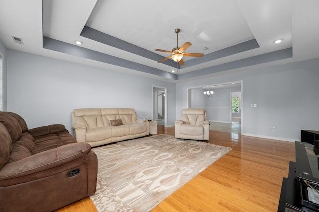 2606 Battleground Dr, Murfreesboro, TN 37129 - living area with a raised ceiling, a ceiling fan, wood finished floors, a chandelier, and recessed lighting
