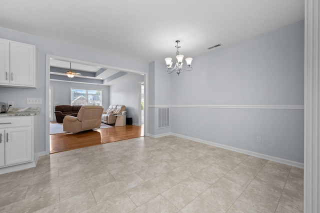 2606 Battleground Dr, Murfreesboro, TN 37129 - dining area featuring a chandelier, a raised ceiling, and a ceiling fan