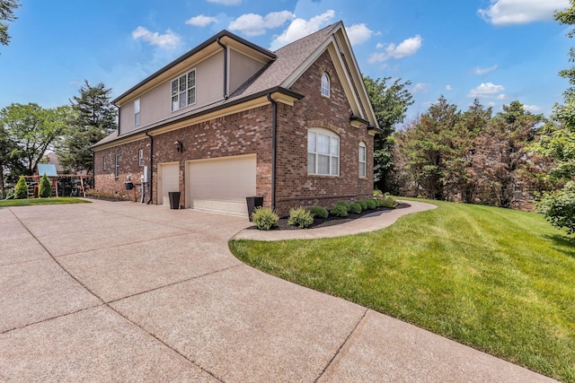 1803 Benziger Ter, Brentwood, TN 37027 - view of side of home featuring an attached garage, brick siding, a lawn, driveway, and stucco siding