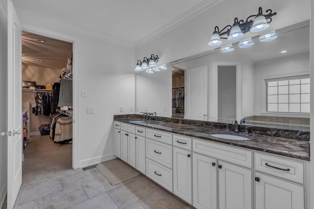1803 Benziger Ter, Brentwood, TN 37027 - bathroom featuring double vanity, a walk in closet, and crown molding
