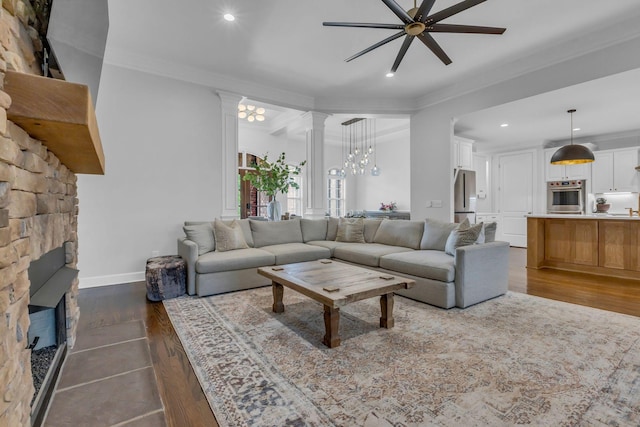 1803 Benziger Ter, Brentwood, TN 37027 - living area featuring ceiling fan, recessed lighting, ornate columns, a fireplace, and dark wood-style flooring
