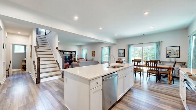 3428 Pepper Glendale Dr, Murfreesboro, TN 37128 - kitchen with appliances with stainless steel finishes, white cabinets, recessed lighting, light wood-type flooring, and light countertops