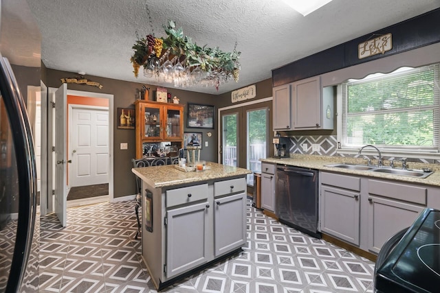 144 Waggoner St, Carthage, TN 37030 - kitchen with dishwashing machine, gray cabinetry, light countertops, range, and a textured ceiling
