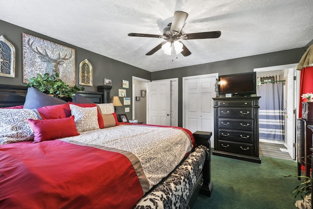 144 Waggoner St, Carthage, TN 37030 - bedroom with two closets, a textured ceiling, dark colored carpet, and ceiling fan
