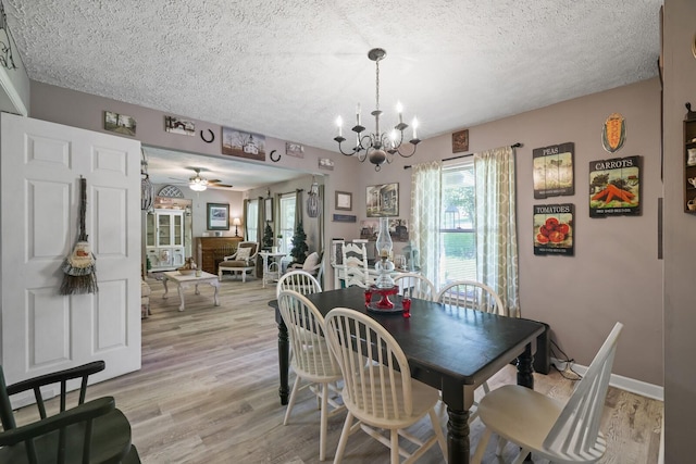 144 Waggoner St, Carthage, TN 37030 - dining space featuring healthy amount of natural light, a textured ceiling, light wood-style flooring, and a chandelier