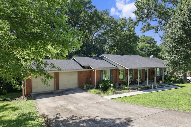 144 Waggoner St, Carthage, TN 37030 - ranch-style house featuring a front yard, an attached garage, concrete driveway, brick siding, and roof with shingles