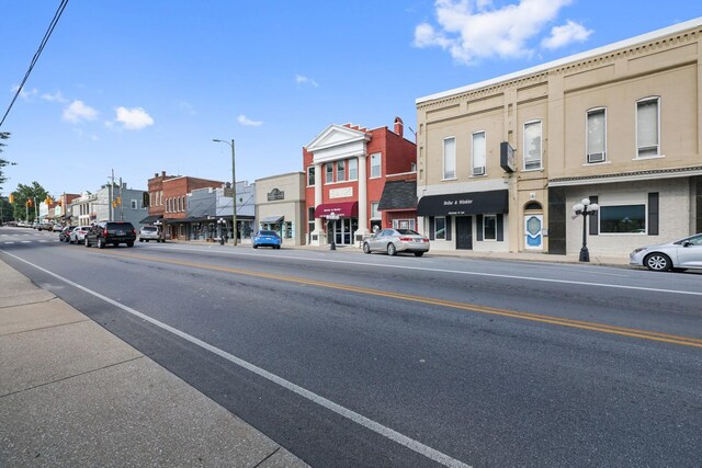 144 Waggoner St, Carthage, TN 37030 - view of asphalt road featuring sidewalks, street lighting, a residential view, and curbs