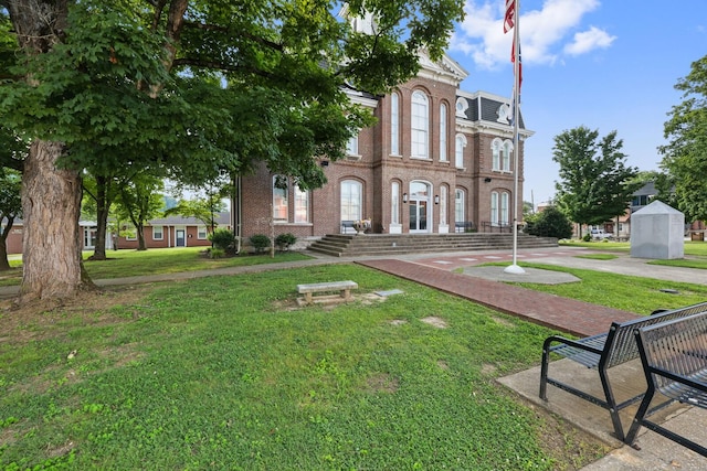 144 Waggoner St, Carthage, TN 37030 - view of front of house with brick siding and a front yard