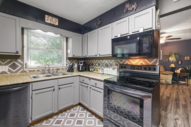 144 Waggoner St, Carthage, TN 37030 - kitchen featuring stainless steel appliances, a textured ceiling, light countertops, a ceiling fan, and backsplash
