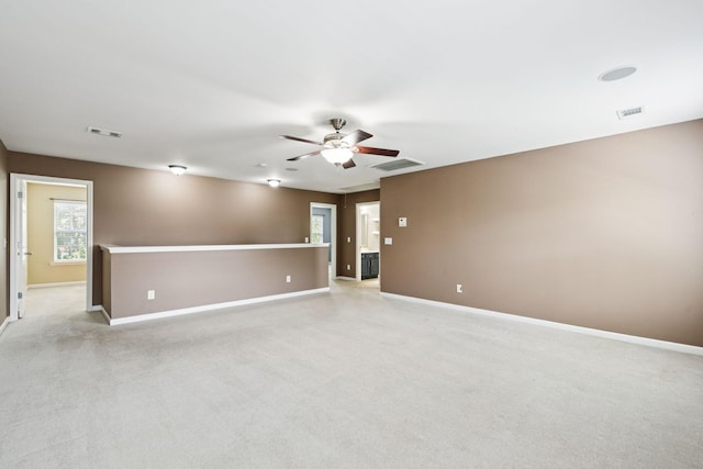 6014 Thrush Ct, Spring Hill, TN 37174 - empty room featuring a ceiling fan, light colored carpet, and healthy amount of natural light