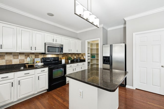 6014 Thrush Ct, Spring Hill, TN 37174 - kitchen featuring appliances with stainless steel finishes, ornamental molding, dark wood finished floors, tasteful backsplash, and white cabinets