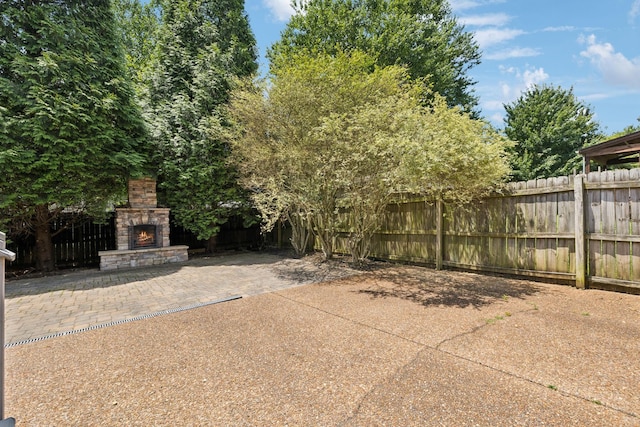 6014 Thrush Ct, Spring Hill, TN 37174 - view of patio / terrace with an outdoor stone fireplace