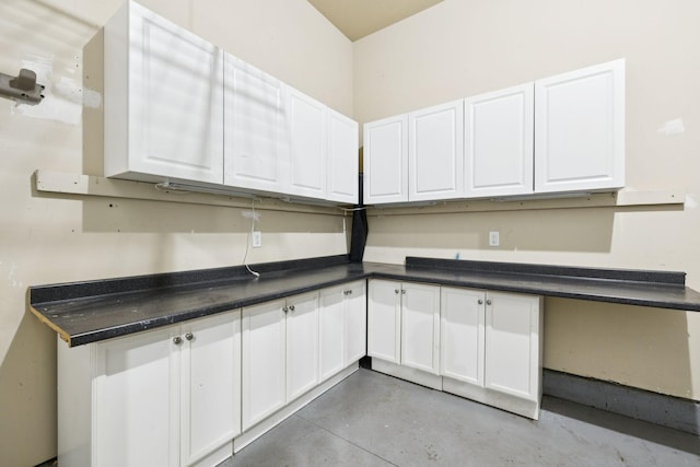 6014 Thrush Ct, Spring Hill, TN 37174 - kitchen with white cabinets, finished concrete flooring, and dark countertops