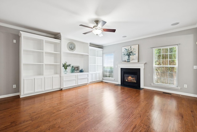 6014 Thrush Ct, Spring Hill, TN 37174 - unfurnished living room featuring ceiling fan, healthy amount of natural light, wood finished floors, crown molding, and a fireplace with flush hearth