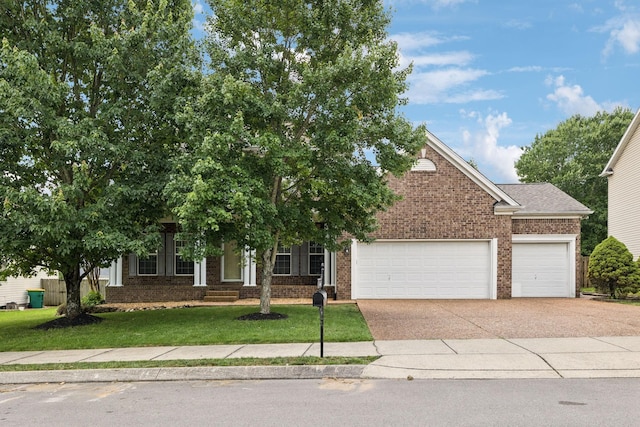 6014 Thrush Ct, Spring Hill, TN 37174 - obstructed view of property featuring a garage, brick siding, a front yard, and driveway