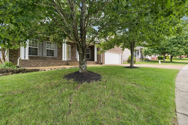 6014 Thrush Ct, Spring Hill, TN 37174 - obstructed view of property with concrete driveway, a front yard, brick siding, and an attached garage