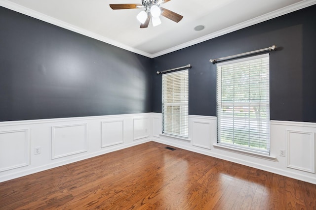 6014 Thrush Ct, Spring Hill, TN 37174 - spare room with a ceiling fan, plenty of natural light, wainscoting, ornamental molding, and wood finished floors