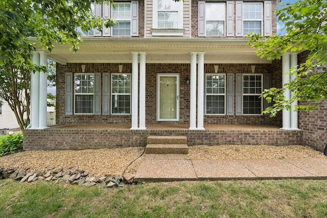 6014 Thrush Ct, Spring Hill, TN 37174 - property entrance with a porch, french doors, and brick siding