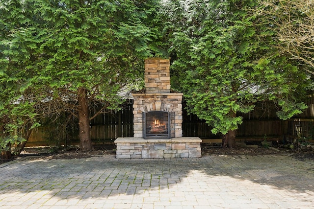 6014 Thrush Ct, Spring Hill, TN 37174 - view of patio / terrace featuring an outdoor stone fireplace