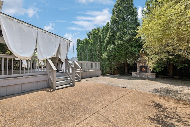 6014 Thrush Ct, Spring Hill, TN 37174 - view of patio featuring an outdoor stone fireplace