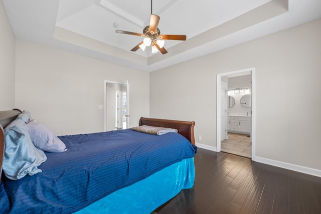 3162 Cross Ridge Dr, Clarksville, TN 37040 - bedroom featuring a tray ceiling, hardwood / wood-style flooring, ensuite bath, and ceiling fan
