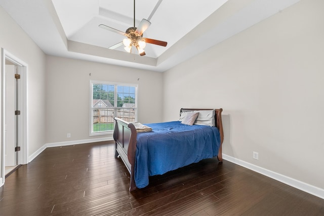 3162 Cross Ridge Dr, Clarksville, TN 37040 - bedroom featuring a raised ceiling, dark wood-type flooring, and a ceiling fan