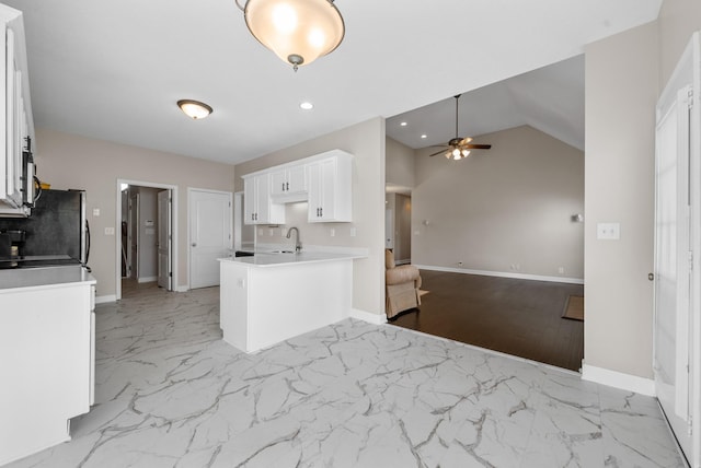 3162 Cross Ridge Dr, Clarksville, TN 37040 - kitchen featuring a ceiling fan, white cabinetry, light marble finish flooring, open floor plan, and light countertops