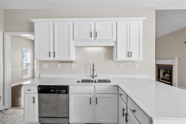 3162 Cross Ridge Dr, Clarksville, TN 37040 - kitchen with stainless steel dishwasher, a peninsula, white cabinets, light marble finish floors, and a fireplace