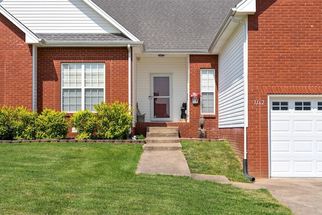 3162 Cross Ridge Dr, Clarksville, TN 37040 - entrance to property with roof with shingles, a lawn, brick siding, and a garage