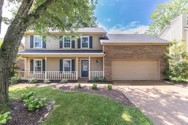 538 Maplegrove Dr, Franklin, TN 37064 - view of front facade with driveway, brick siding, an attached garage, a porch, and a front lawn
