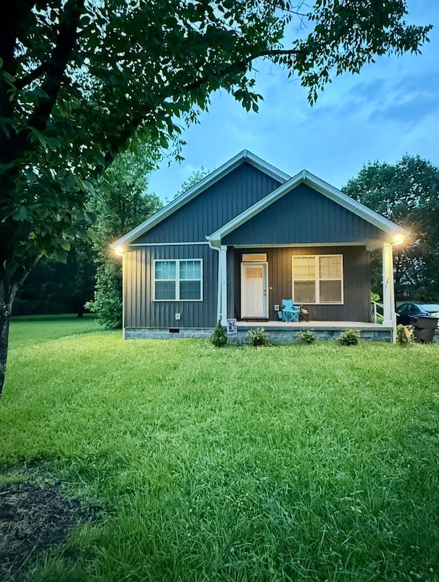 4335 Hawkins Dr, Westmoreland, TN 37186 - view of front of house with a front lawn and covered porch