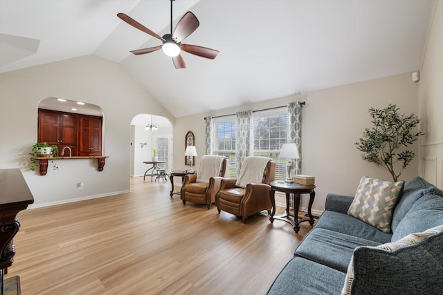 305 Davis Green Ln, Spring Hill, TN 37174 - living room with arched walkways, ceiling fan, vaulted ceiling, and light wood-style flooring