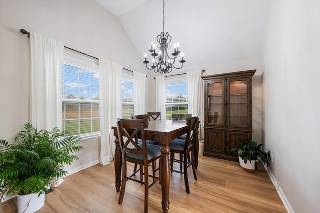 305 Davis Green Ln, Spring Hill, TN 37174 - dining area featuring a chandelier, light wood-type flooring, and high vaulted ceiling