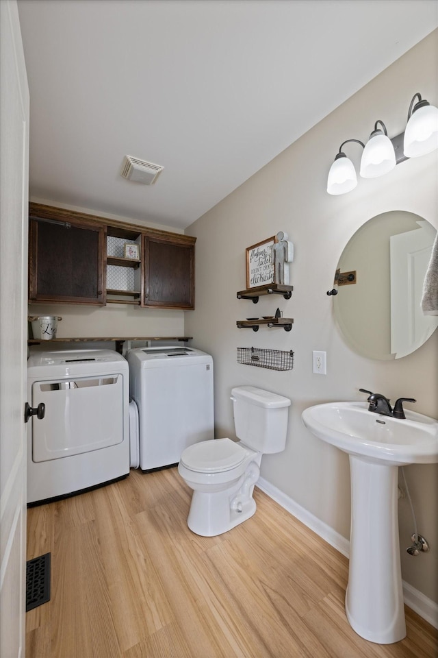 305 Davis Green Ln, Spring Hill, TN 37174 - half bath with washing machine and clothes dryer and wood finished floors