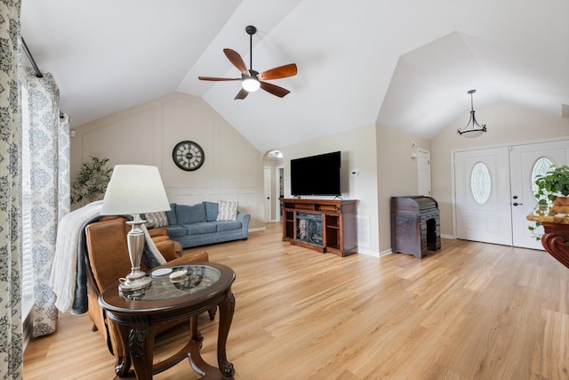 305 Davis Green Ln, Spring Hill, TN 37174 - living room with vaulted ceiling, wood finished floors, a ceiling fan, and a wood stove
