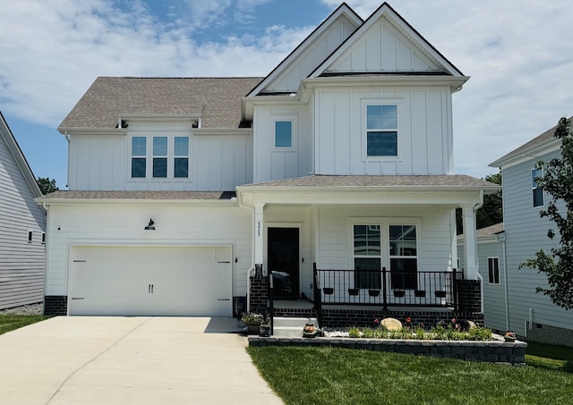 6683 Hanworth Trce, Smyrna, TN 37167 - view of front of house featuring covered porch, board and batten siding, driveway, and a garage