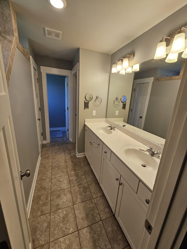 6005 Sentinel Dr, Spring Hill, TN 37174 - full bath with double vanity and tile patterned flooring