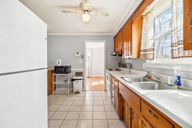 810 Country Club Dr, Clarksville, TN 37043 - kitchen featuring white appliances, brown cabinets, light countertops, light tile patterned floors, and a textured ceiling