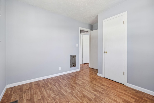 810 Country Club Dr, Clarksville, TN 37043 - unfurnished bedroom with light wood finished floors and a textured ceiling
