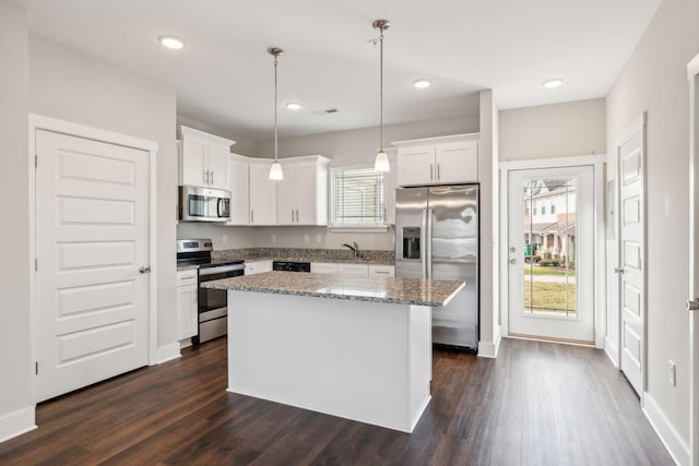7026 Magnolia Crossings, Spring Hill, TN 37174 - kitchen featuring stainless steel appliances, healthy amount of natural light, white cabinetry, dark wood-type flooring, and recessed lighting