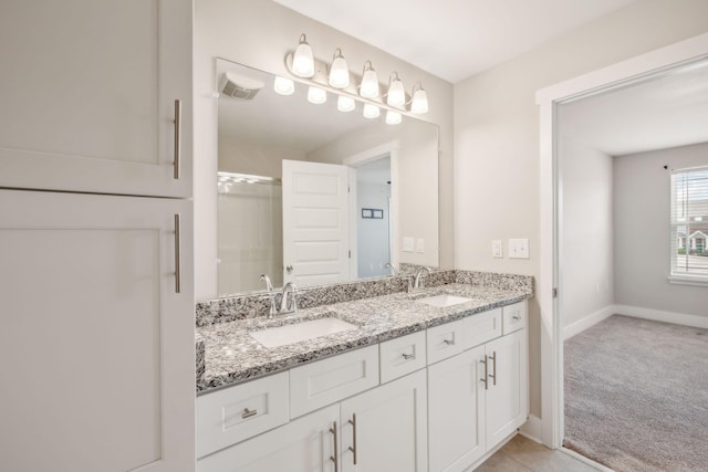 7026 Magnolia Crossings, Spring Hill, TN 37174 - bathroom with double vanity and baseboards
