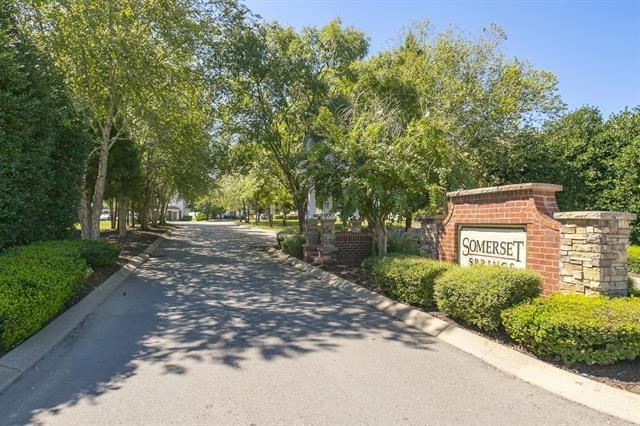 7026 Magnolia Crossings, Spring Hill, TN 37174 - view of asphalt road with curbs