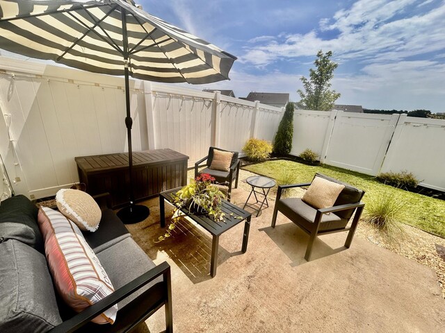 1000 June Wilde Rdg, Spring Hill, TN 37174 - fenced backyard with outdoor lounge area and a patio area