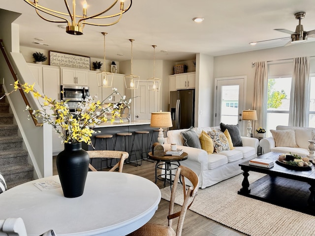 1000 June Wilde Rdg, Spring Hill, TN 37174 - living area with stairs, a chandelier, dark wood-type flooring, ceiling fan, and recessed lighting