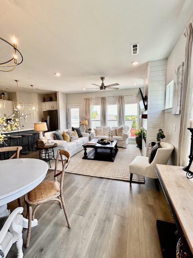 1000 June Wilde Rdg, Spring Hill, TN 37174 - living area featuring wood finished floors, ceiling fan, a chandelier, and recessed lighting